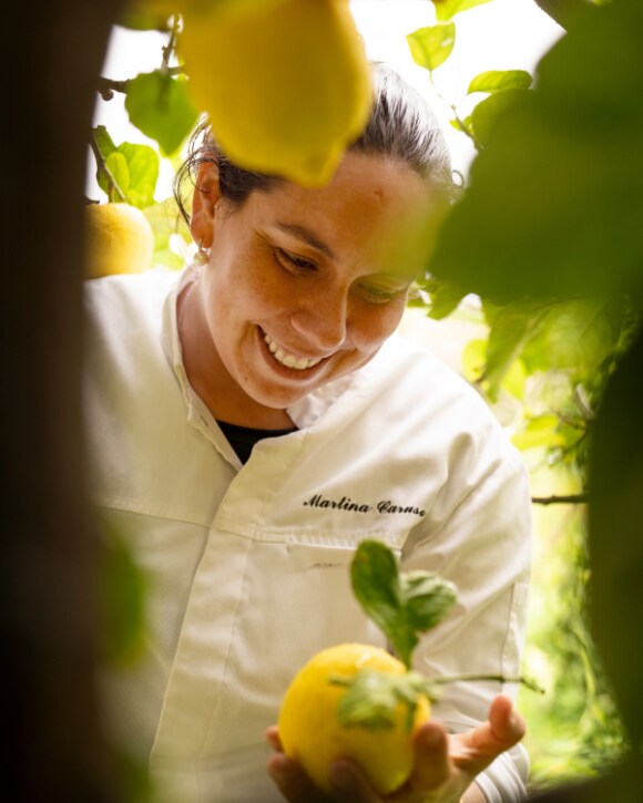 Martina Caruso preparing a plate and a bottle of La Grande Dame 2015 Martina Caruso preparing a plate and a bottle of La Grande Dame 2015